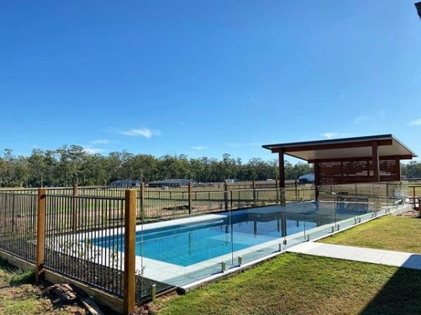 Pool With Fence And Patio — Pool Fencing in Benowa, QLD