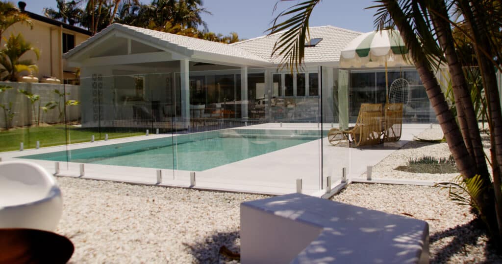 Modern Outdoor Pool — Pool Fencing in Benowa, QLD