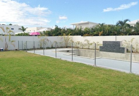Lap Pool With Fence Near Lawn — Pool Fencing in Benowa, QLD
