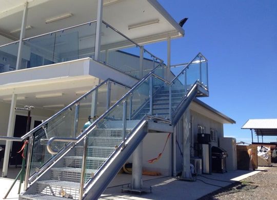 Handrail With Glass And Stainless Steel Clamps — Pool Fencing in Benowa, QLD