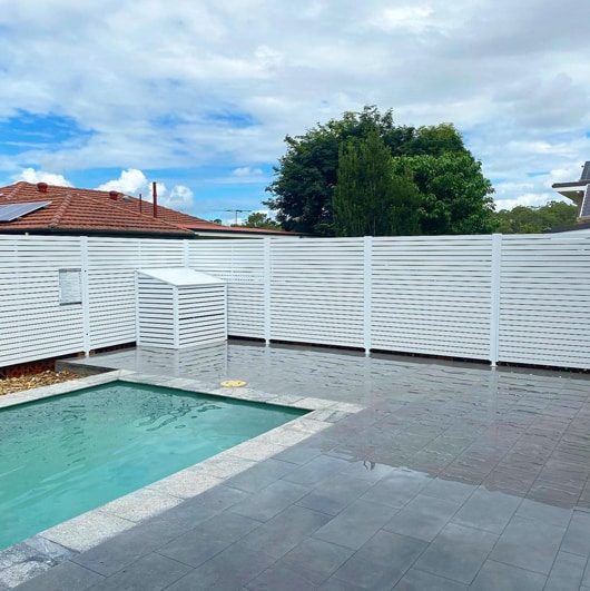 Pool With White-Painted Wooden Pool Fence — Pool Fencing in Benowa, QLD