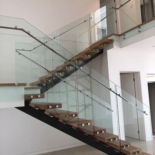 Custom Staircase With Glass Balustrade — Pool Fencing in Benowa, QLD