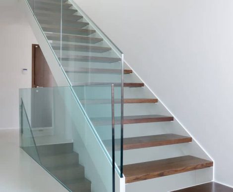 Frameless Glass Balustrades On A White Wall Themed House
