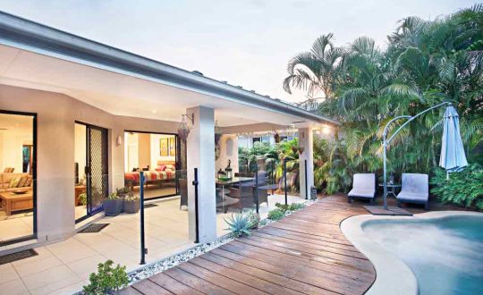 House Garden With Swimming Pool And Glass Fencing — Pool Fencing in Benowa, QLD